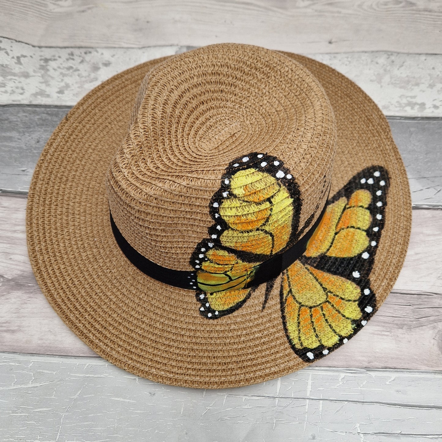 Panama Hat with a Yellow Butterfly print and black band surround.