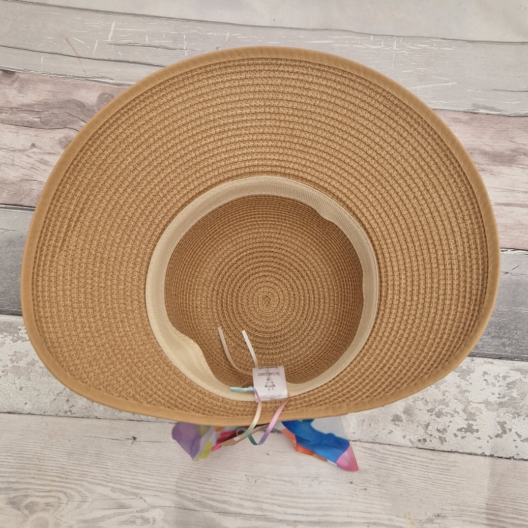 Top down interior view of a beige coloured backless bonnet. An adjustable band can be seen on the inside rim of the crown.