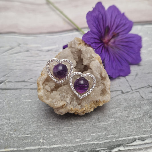 Silver love heart set with a large natural amethyst.