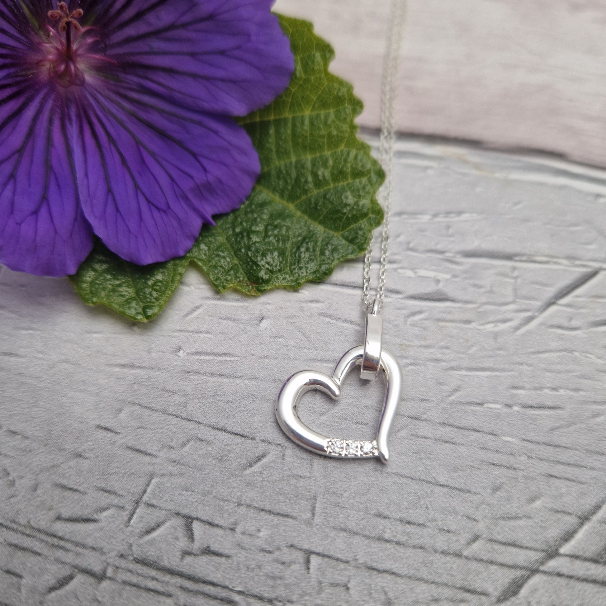 Silver Plated necklace with love heart pendant, set with diamante crystals.