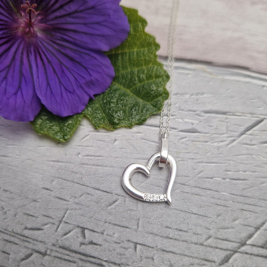 Silver Plated necklace with love heart pendant, set with diamante crystals.