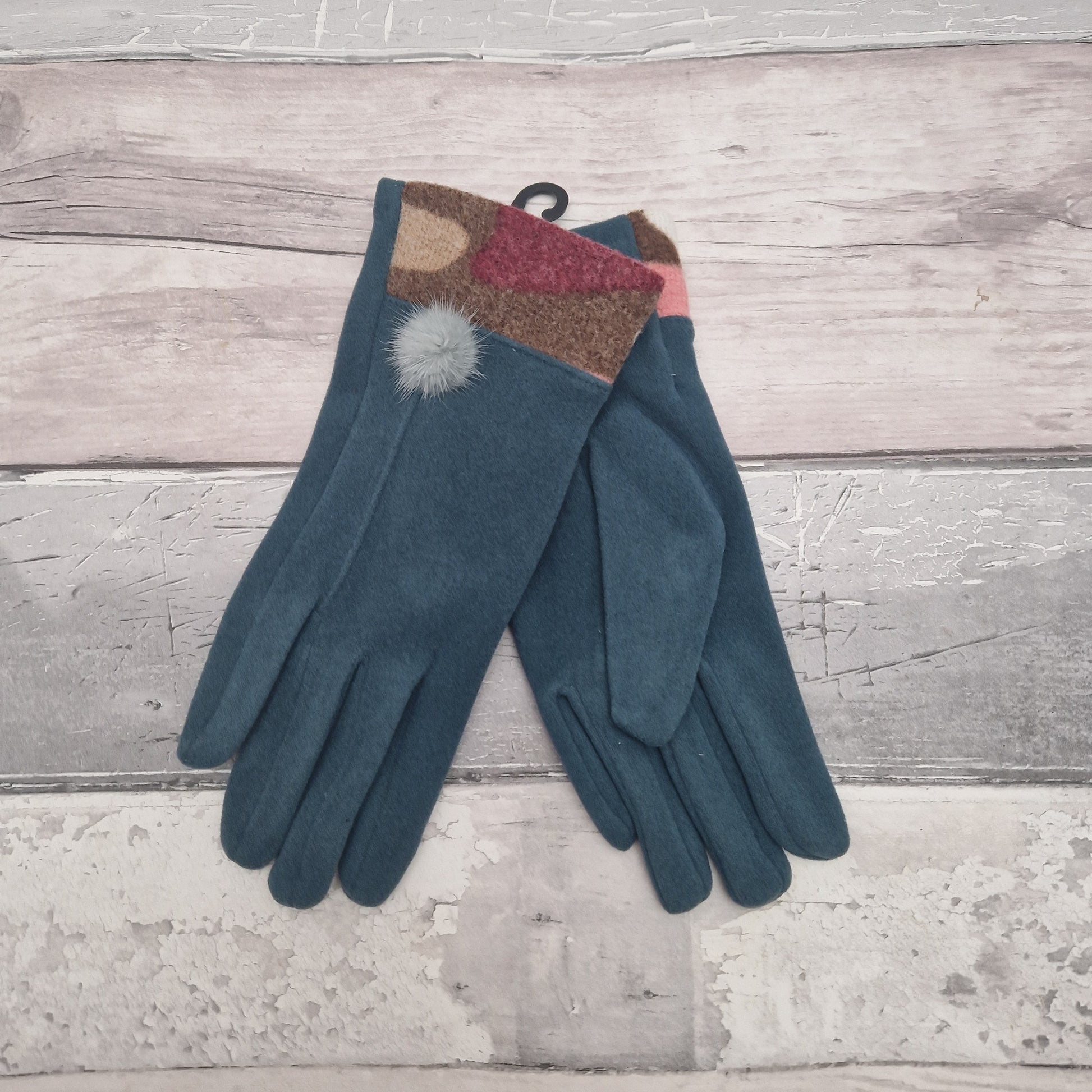 Turquoise Coloured Gloves presented in a Gift Box with a Jazzy coloured cuff and fluffy pom pom finish.