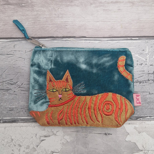 Embroidered cat pouch on a textured gray surface