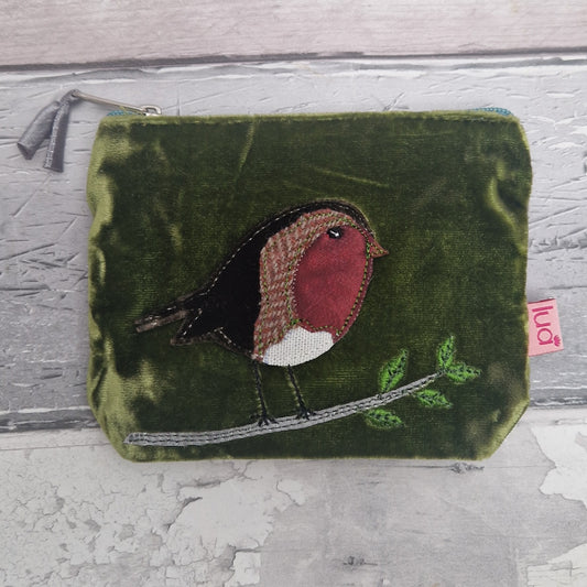 Green pouch with a robin design on a textured surface