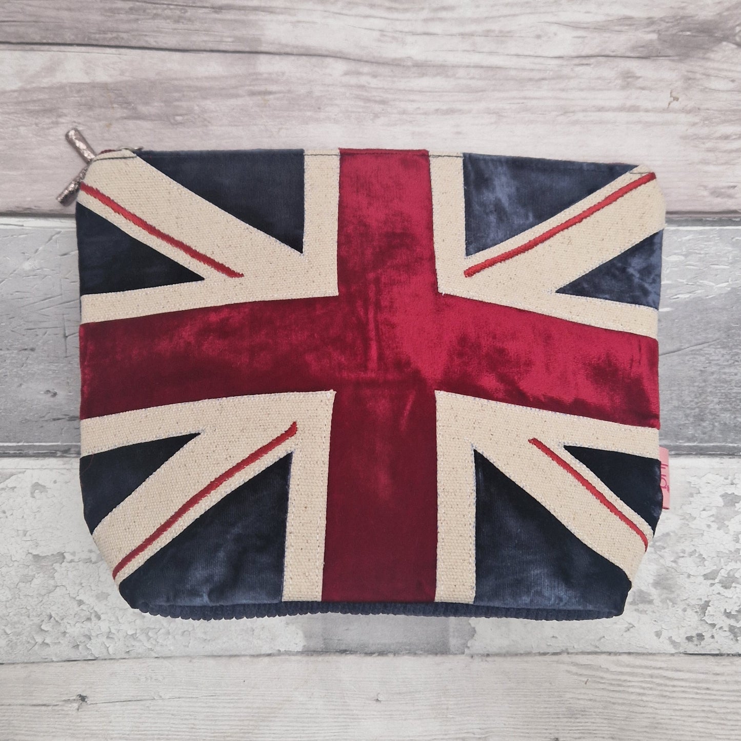 Union Jack design pouch on a wooden surface