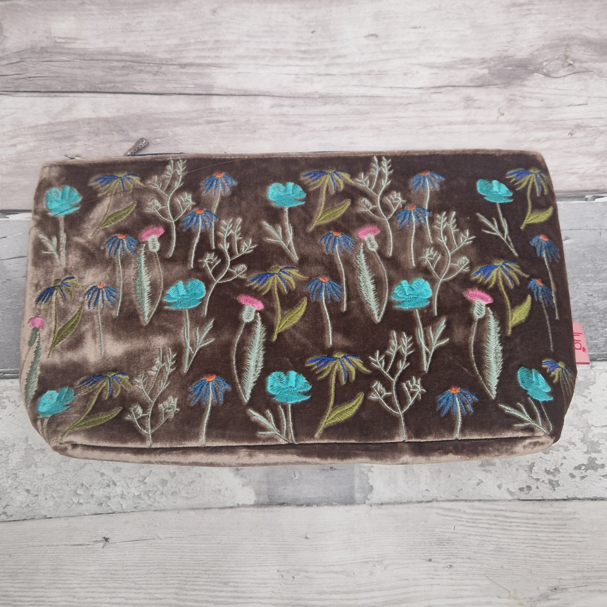 Floral embroidered  bag on a wooden surface
