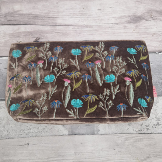 Floral embroidered  bag on a wooden surface