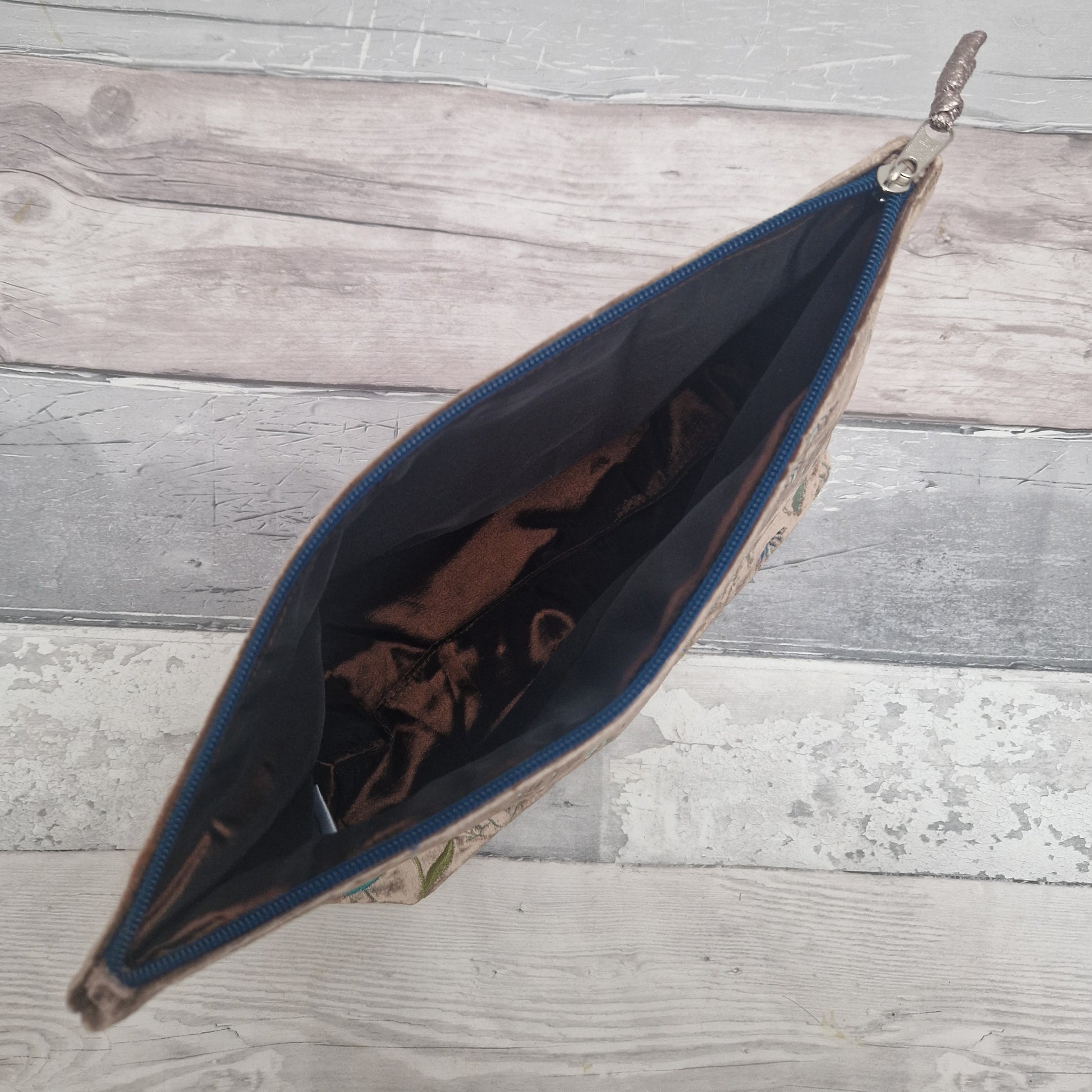 Open bag with floral pattern on a wooden surface