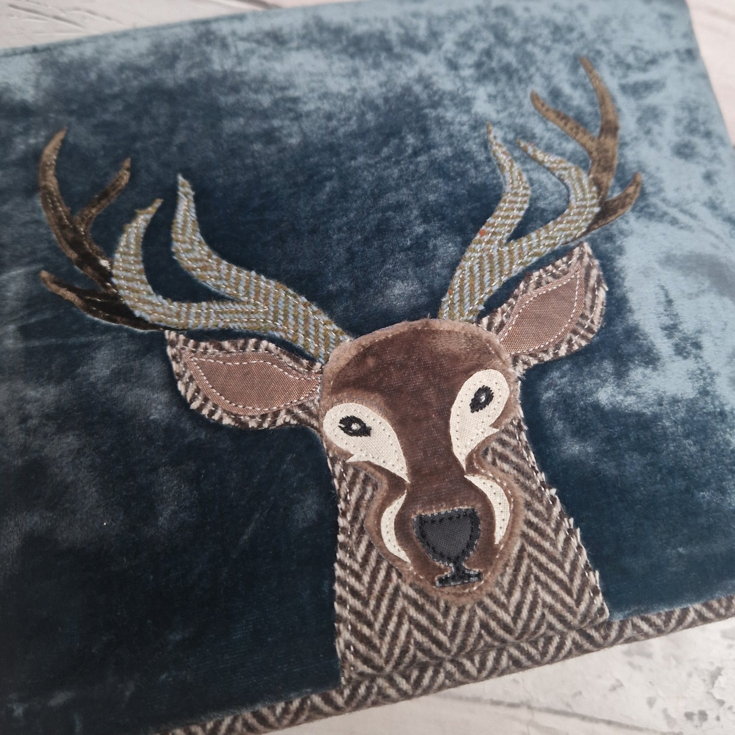Close up view of the Highland Stag Blue Velvet Make up Bag.