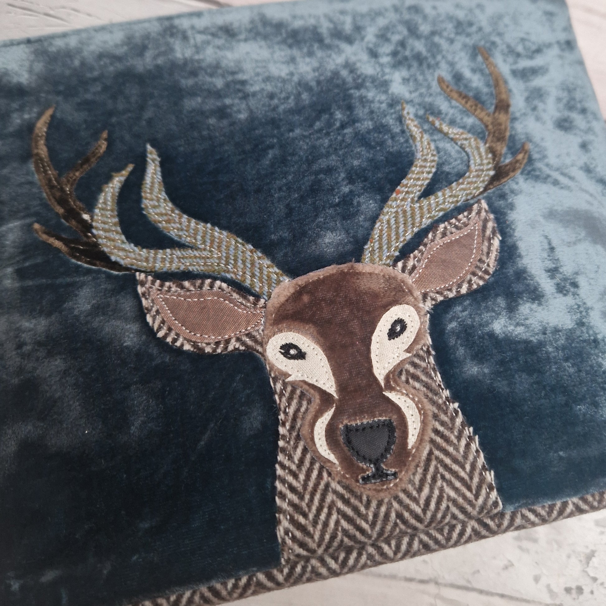 Close up view of the Highland Stag Blue Velvet Make up Bag.