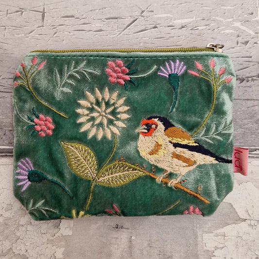 Green velvet coin purse decorated with flowers of pink and purple and embroidered depiction of a Goldfinch.