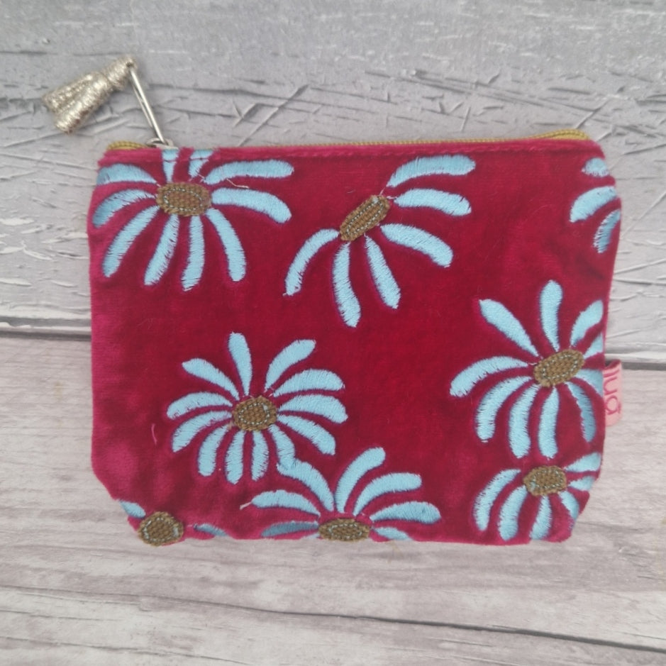 Hot pink velvet coin purse decorated with white daisies.