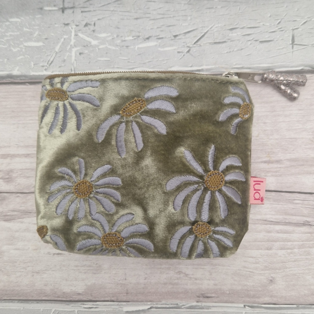 An olive green velvet zippered pouch with embroidered daisy flowers in whites and gold.