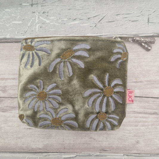 An olive green velvet zippered pouch with embroidered daisy flowers in whites and gold.