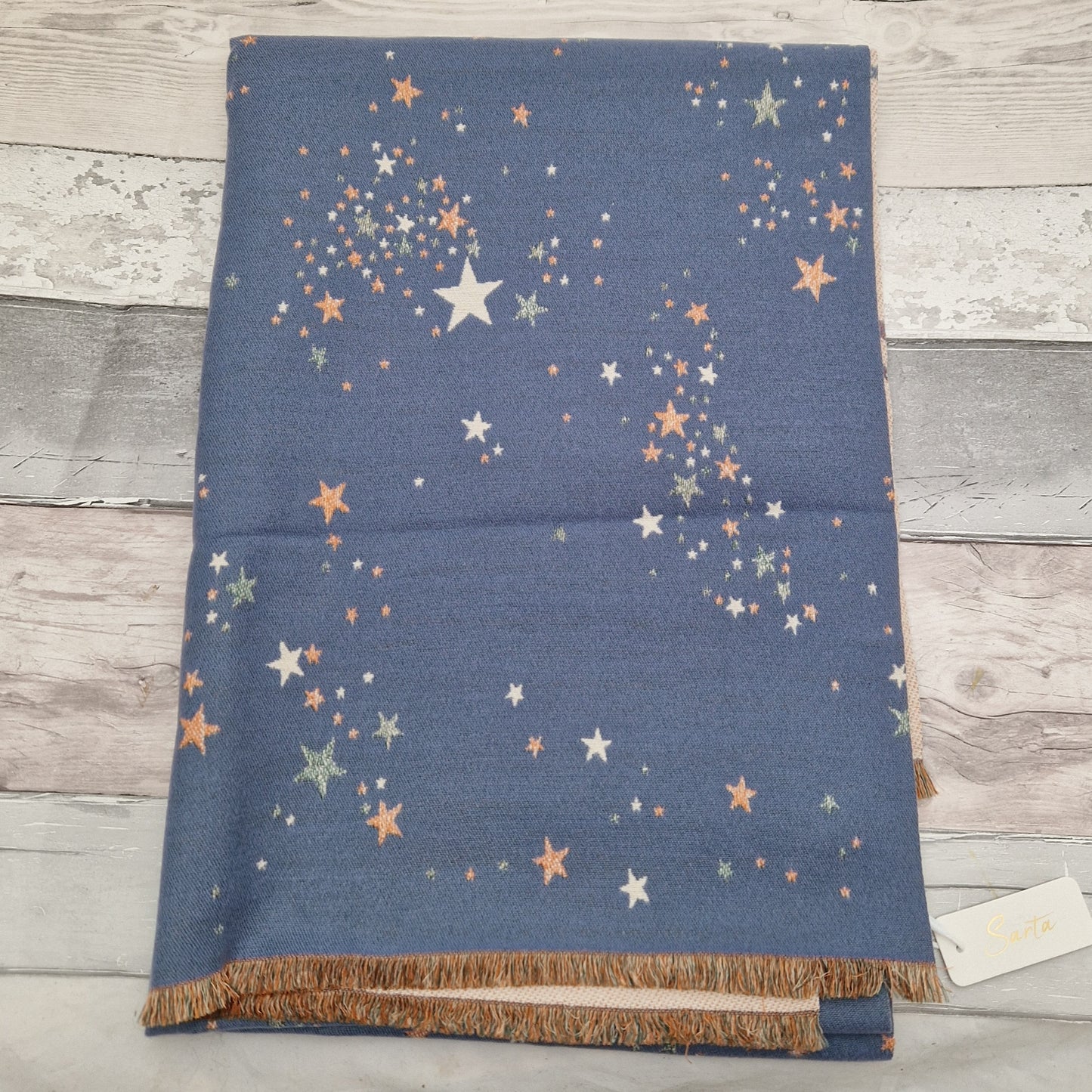Denim Blue Winter Scarf decorated in a star print in colours of orange, cream and grey.