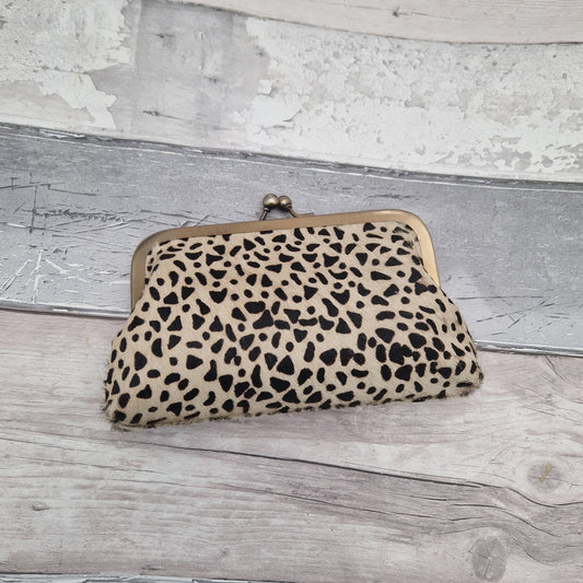 Clutch bag made from textured leather in an Iberian Lynx pattern.