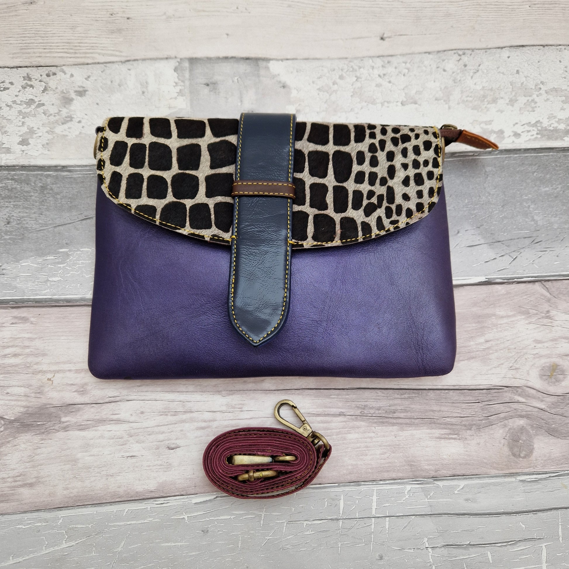 Metallic Purple leather Giraffe print envelope style bag.