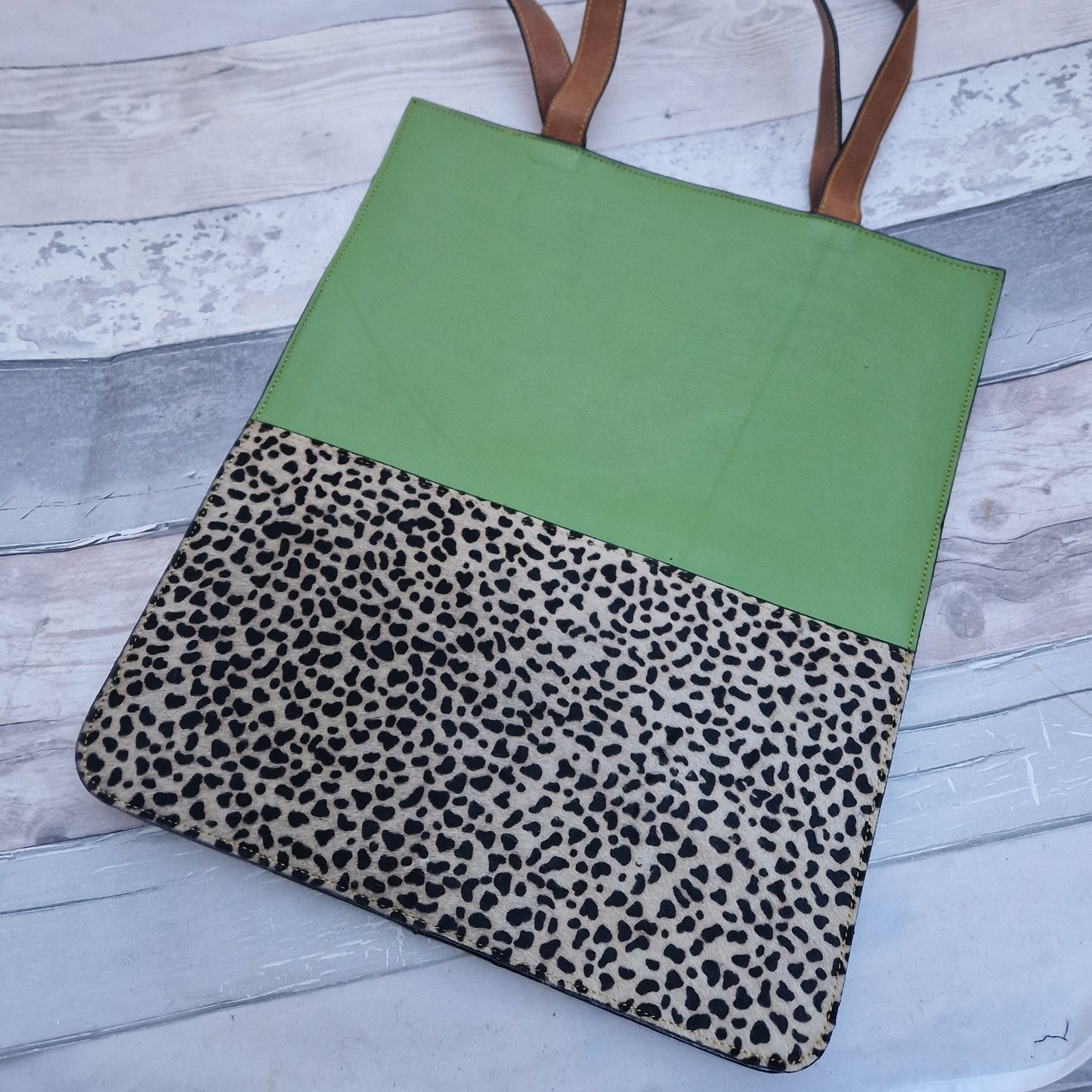 Green Leather tote bag with a textured panel in a micro spot print.