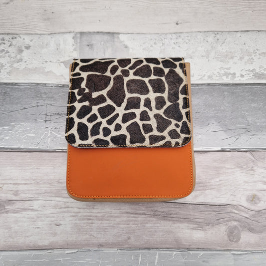 Messenger style bag made from leather off cuts in a mix of colours. Features striking textured panel in Giraffe print.