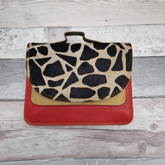 Giraffe print leather made entirely from off cuts in a rainbow of colours.