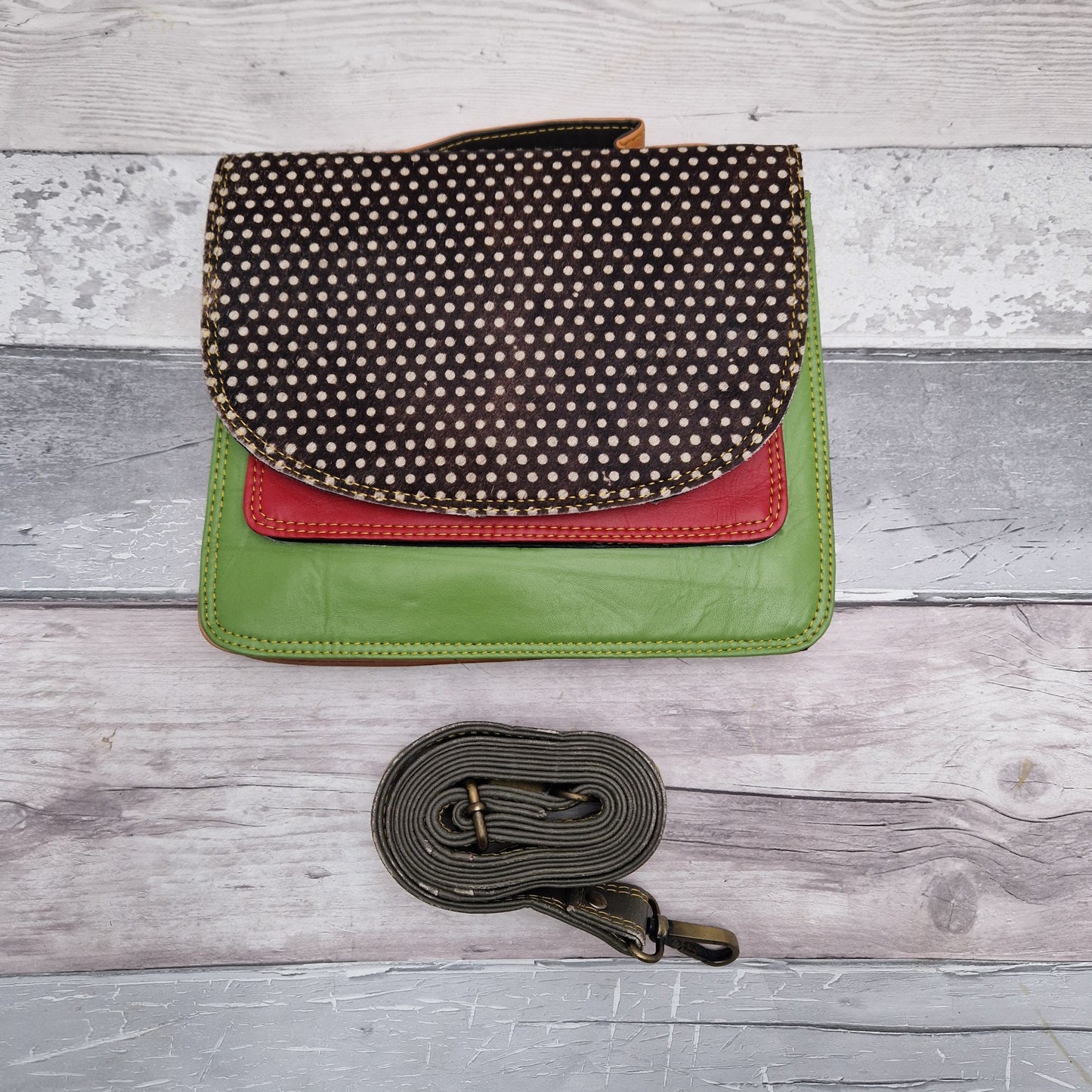 Bright Green leather bag with a textured spot print panel.