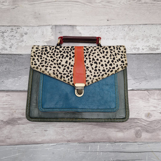 Green Leather satchel style bag with textured front panel in a spot print.