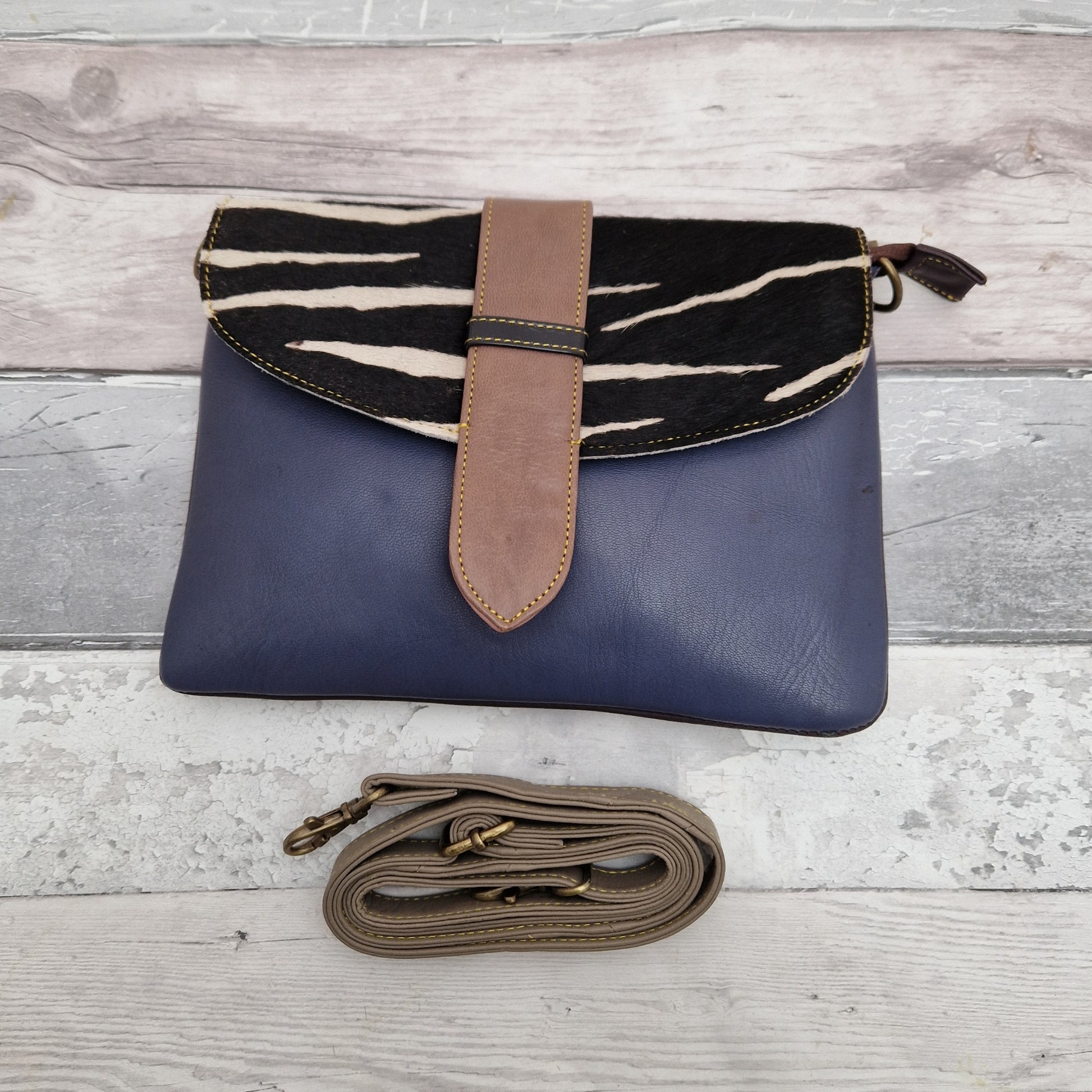 Navy leather bag with a textured panel in Zebra Print.