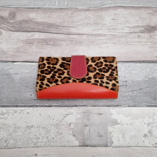 Purse made from leather off cuts featuring textured panels in a Leopard print.