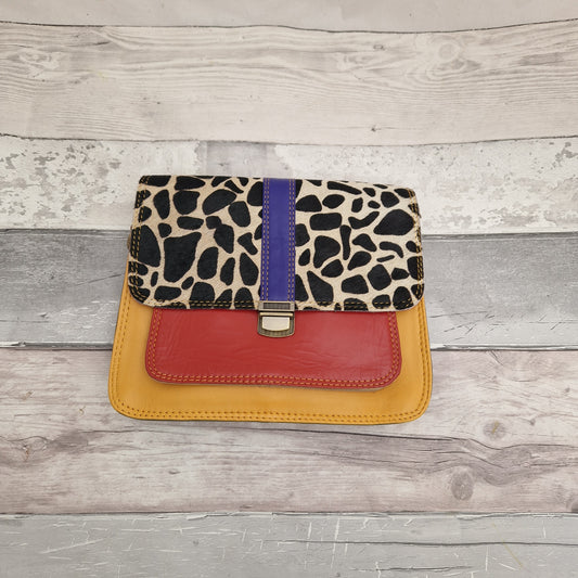 All leather bag made from off-cuts in bright colours. Front panel in textured cow hide in a giraffe print.