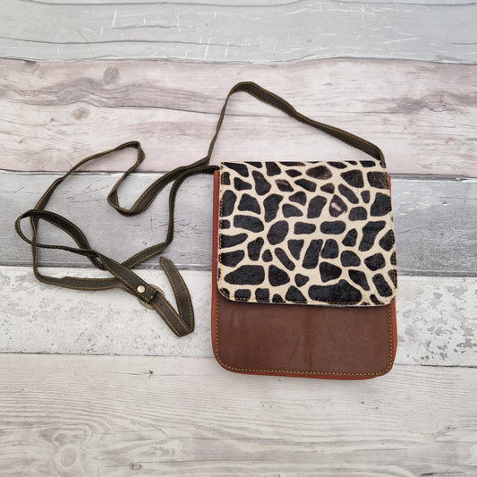 Brown leather Giraffe print messenger style bag.