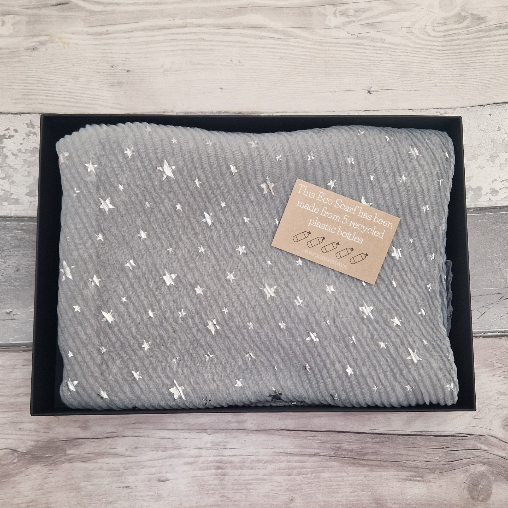 Gift Boxed Eco Scarf in grey covered in metallic silver stars.