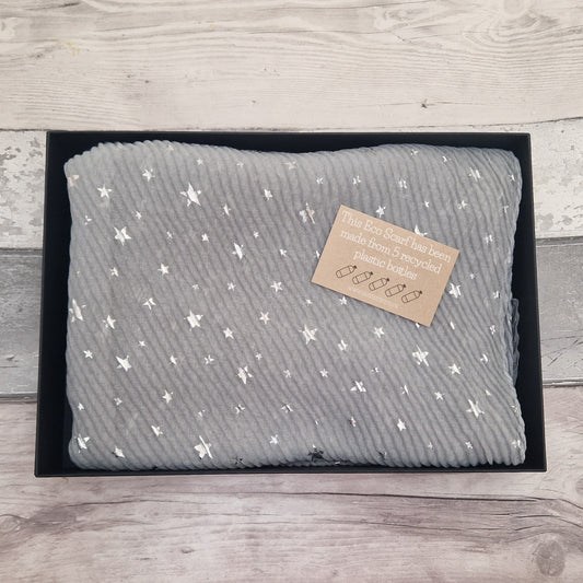 Gift Boxed Eco Scarf in grey covered in metallic silver stars.