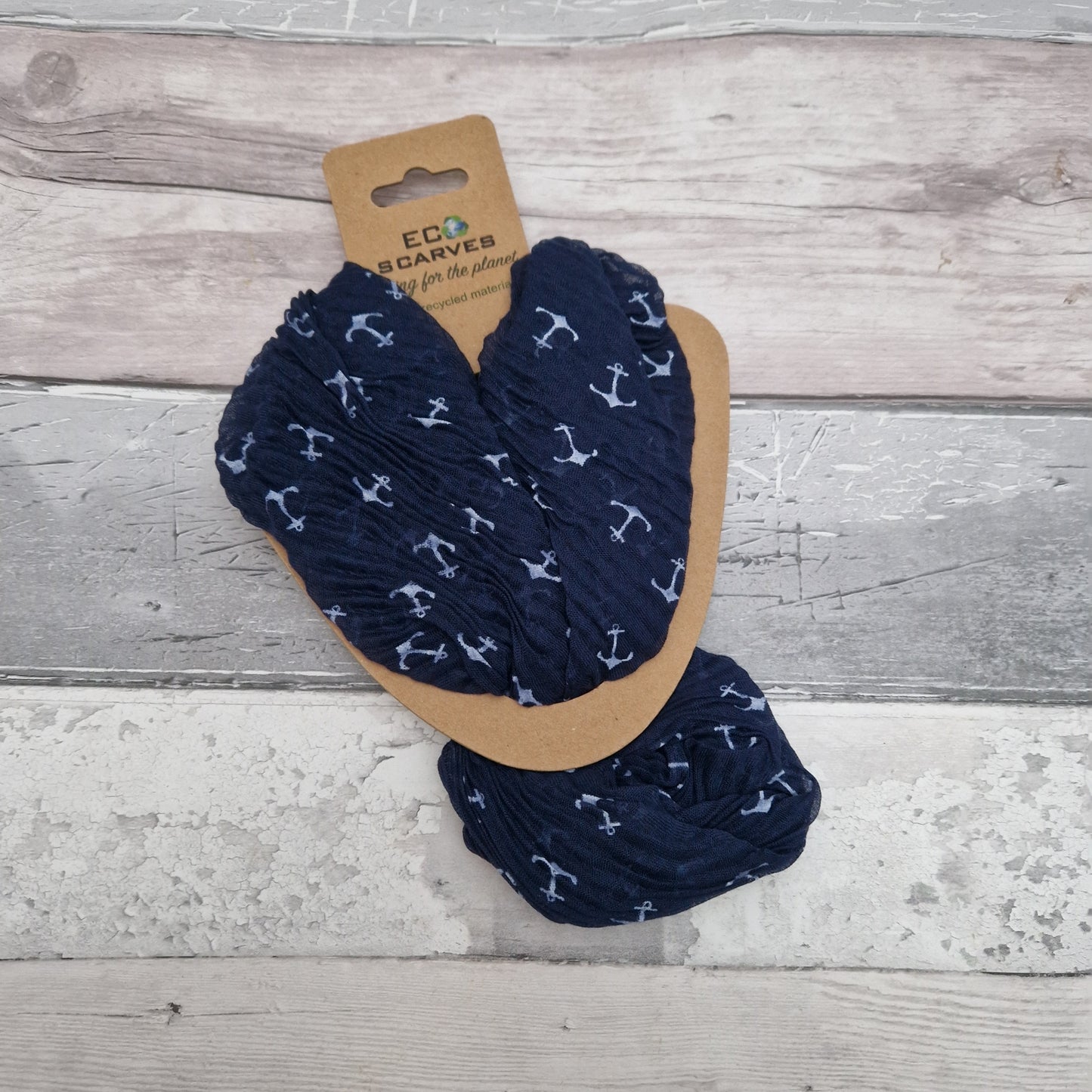 Navy Blue crinkled neck scarf decorated with white anchors.