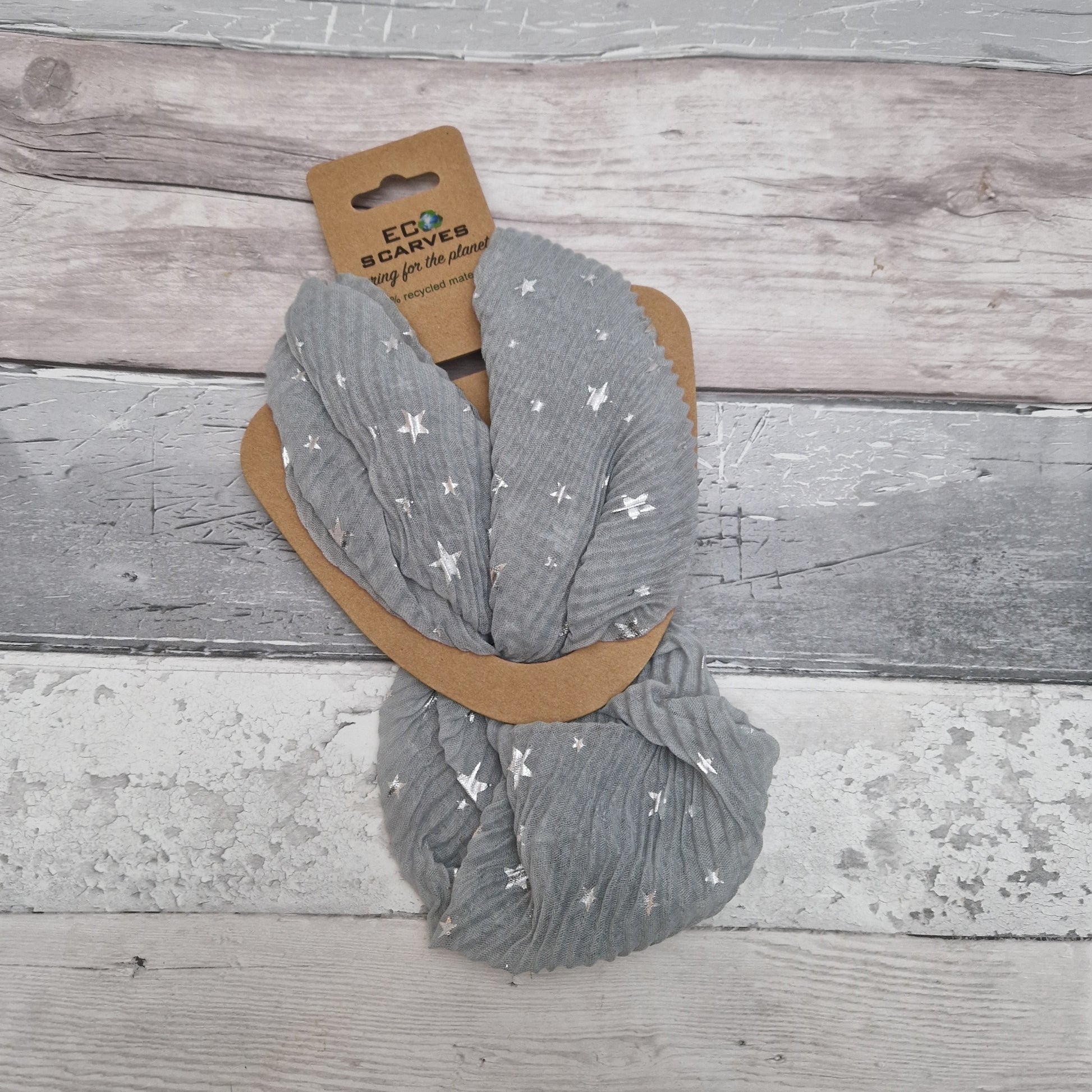 Grey magnetic neck scarf in a crinkle fabric, decorated with metallic silver stars.