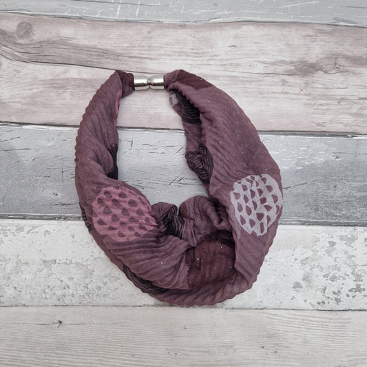 Crinkle effect magnetic neck scarf in dusky pink. Decorated with patterned circles or white, black and maroon.