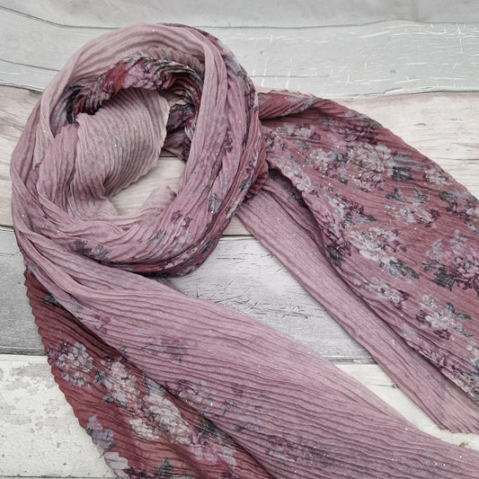 Pink toned scarf decorated with swathes of pink and climbing rose print.