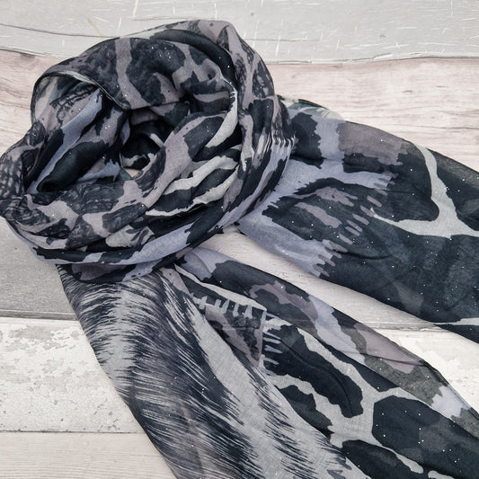 Animal Print scarf in grey, black and white tones.