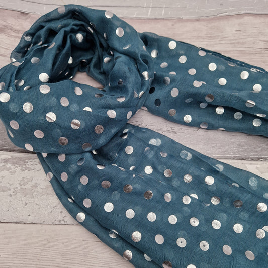 Teal coloured scarf covered in metallic silver spots.