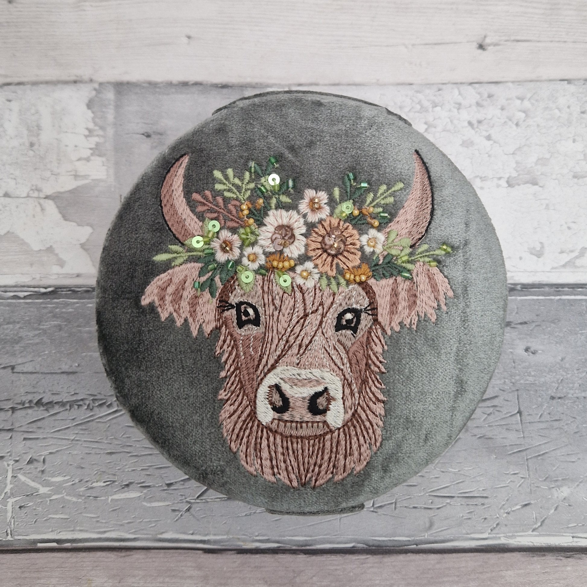 Grey velvet covered jewellery box featuring an embroidered design of a Highland Cow. Finished with beads and sequins.