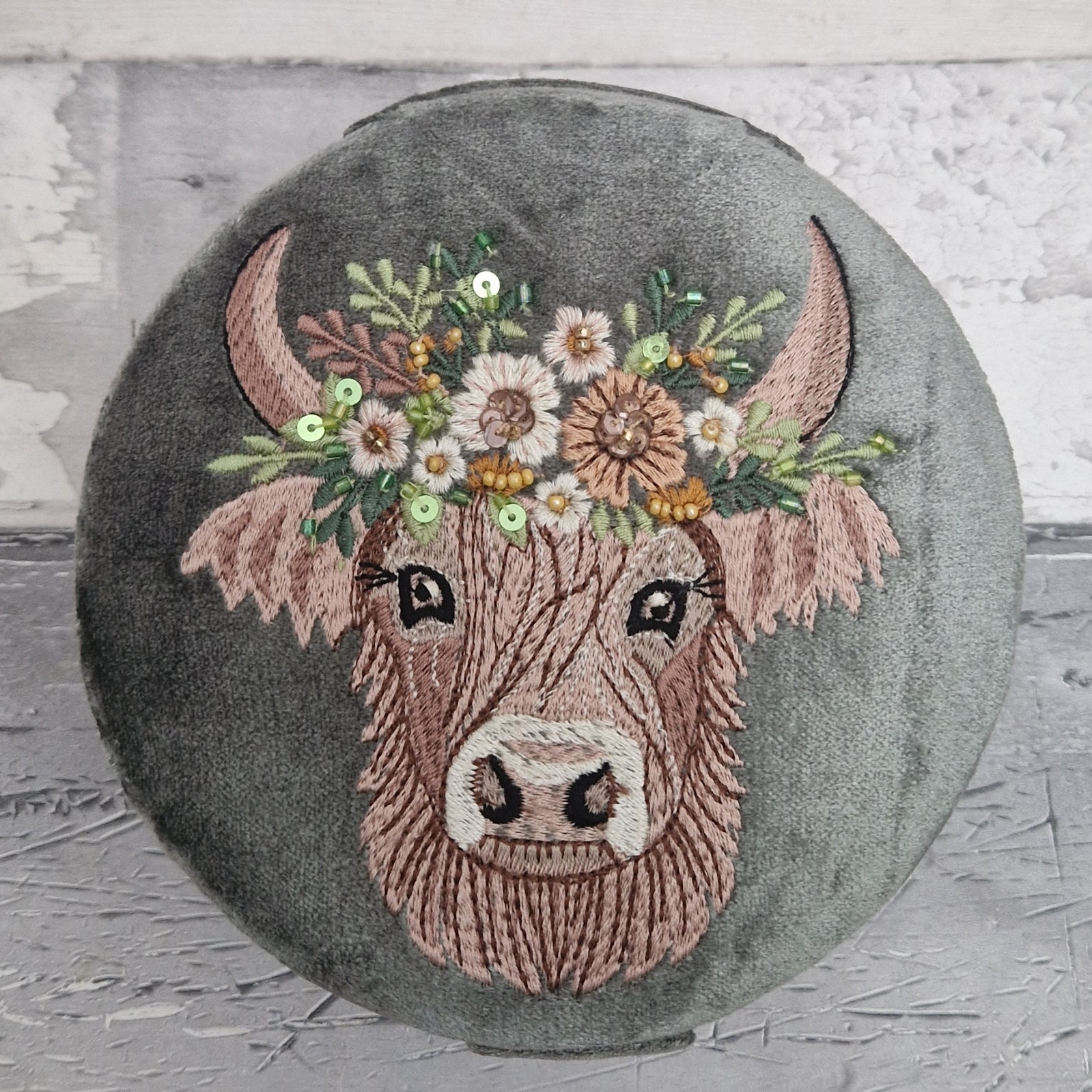 Grey velvet covered jewellery box featuring an embroidered design of a Highland Cow. Finished with beads and sequins.