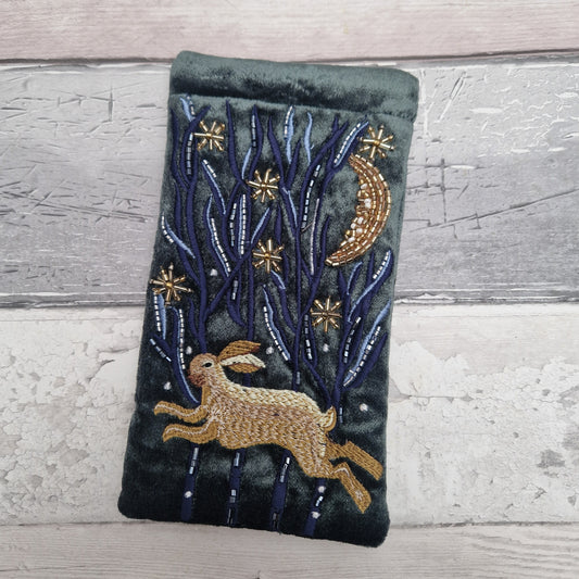 Dark grey velvet glasses case decorated with an embroidered Hare running through the woods under a crescent moon and starry night scene. Finished with beads and sequins.