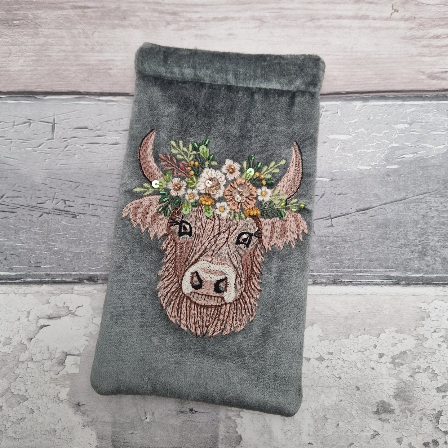 Grey velvet glasses case decorated with an embroidered Highland Cow. Finished with beads and sequins.
