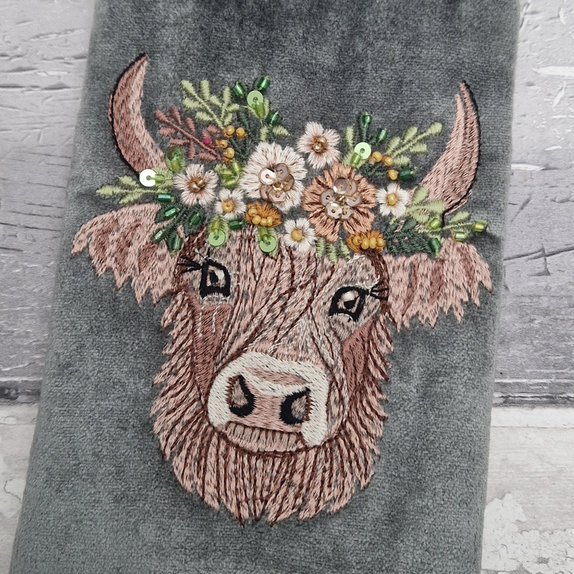 Grey velvet glasses case decorated with an embroidered Highland Cow. Finished with beads and sequins.