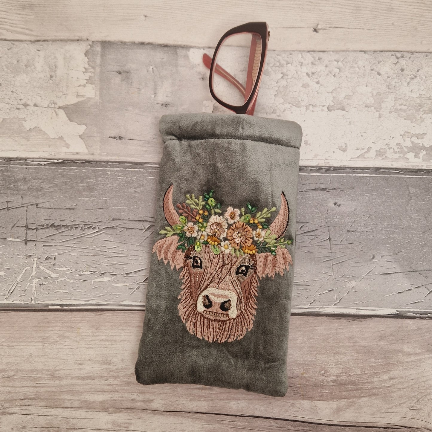 Grey velvet glasses case decorated with an embroidered Highland Cow. Finished with beads and sequins.