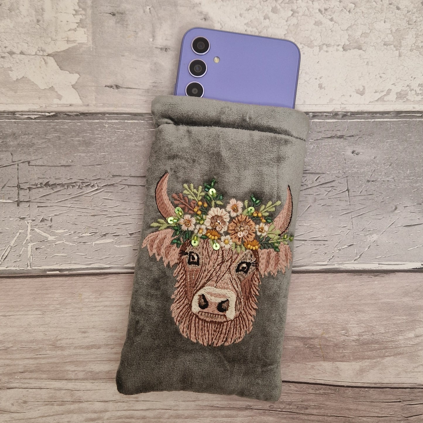 Grey velvet glasses case decorated with an embroidered Highland Cow. Finished with beads and sequins.