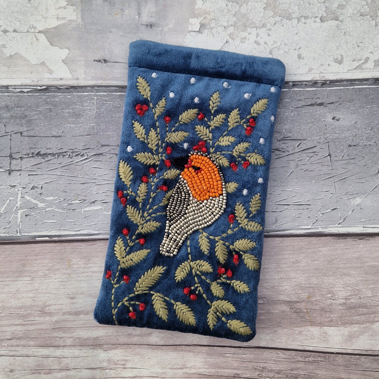 Dusky Blue Velvet Glasses Pouch decorated with an embroidery and bead design featuring a Robin surrounded by festive holly.