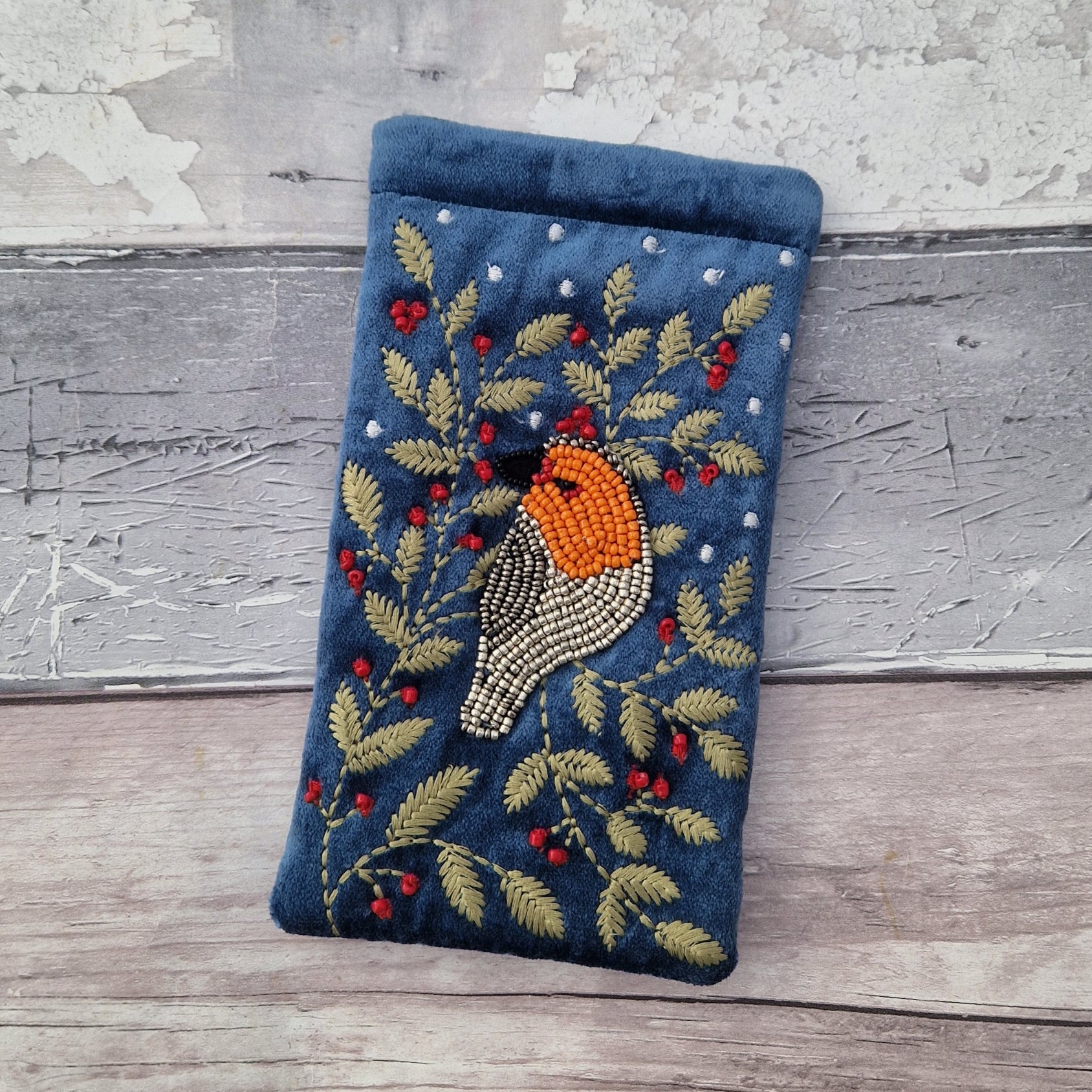 Dusky Blue Velvet Glasses Pouch decorated with an embroidery and bead design featuring a Robin surrounded by festive holly.