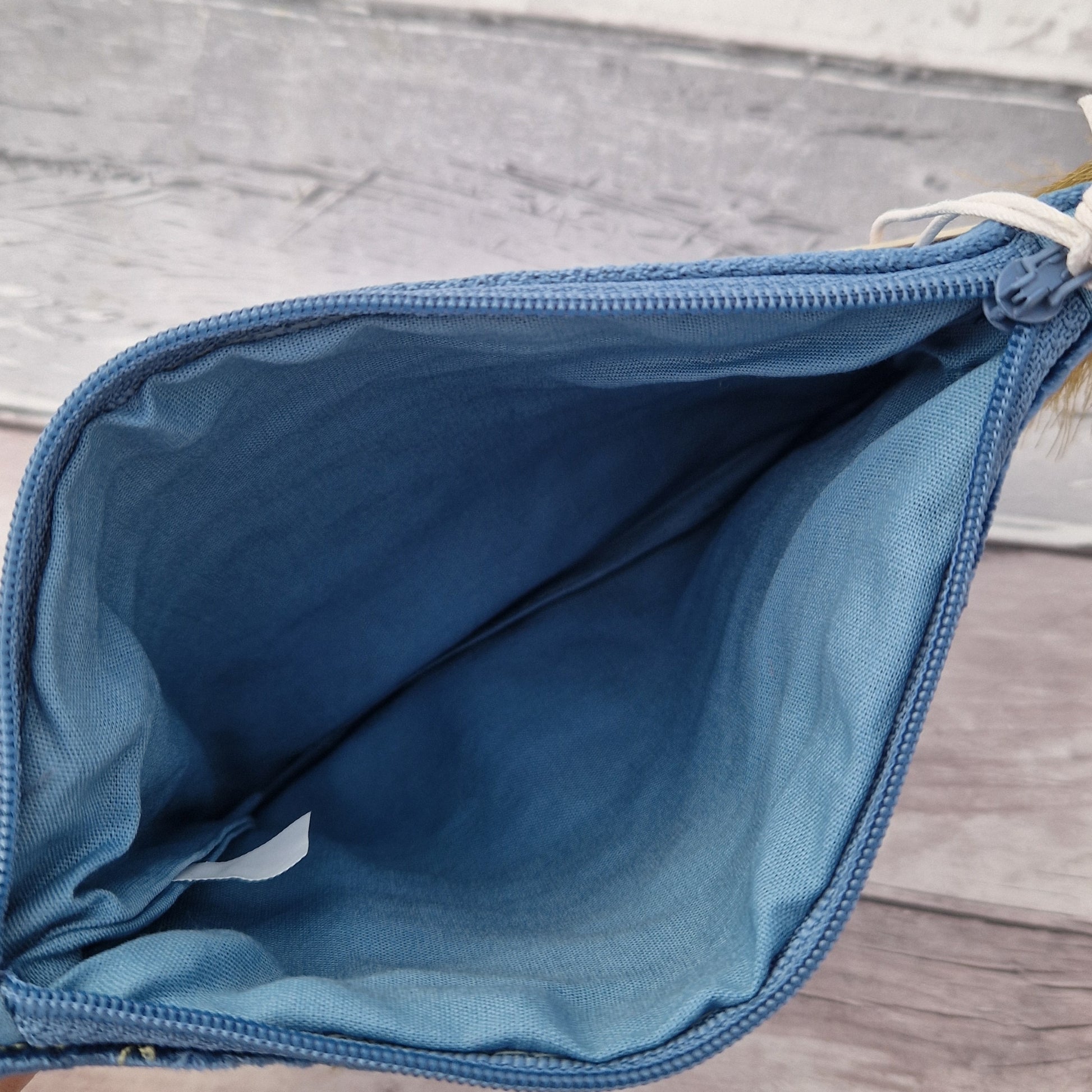 Dusky Blue Velvet Make up Bag decorated with an embroidery and bead design featuring a Robin surrounded by festive holly.