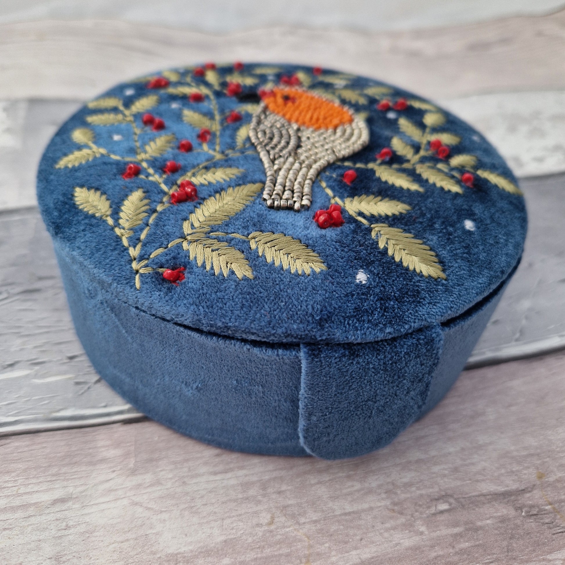 Dusky Blue Velvet Jewellery Box decorated with an embroidery and bead design featuring a Robin surrounded by festive holly.
