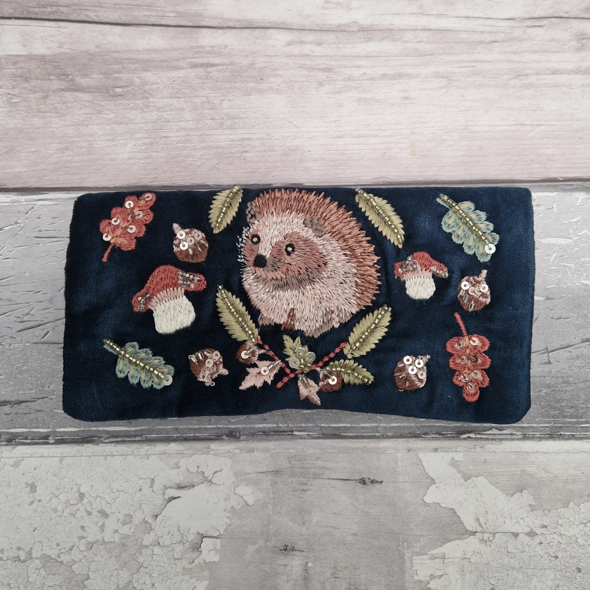 Velvet Jewellery Roll decorated with a hand embroidered image of a Woodland Hedgehog.